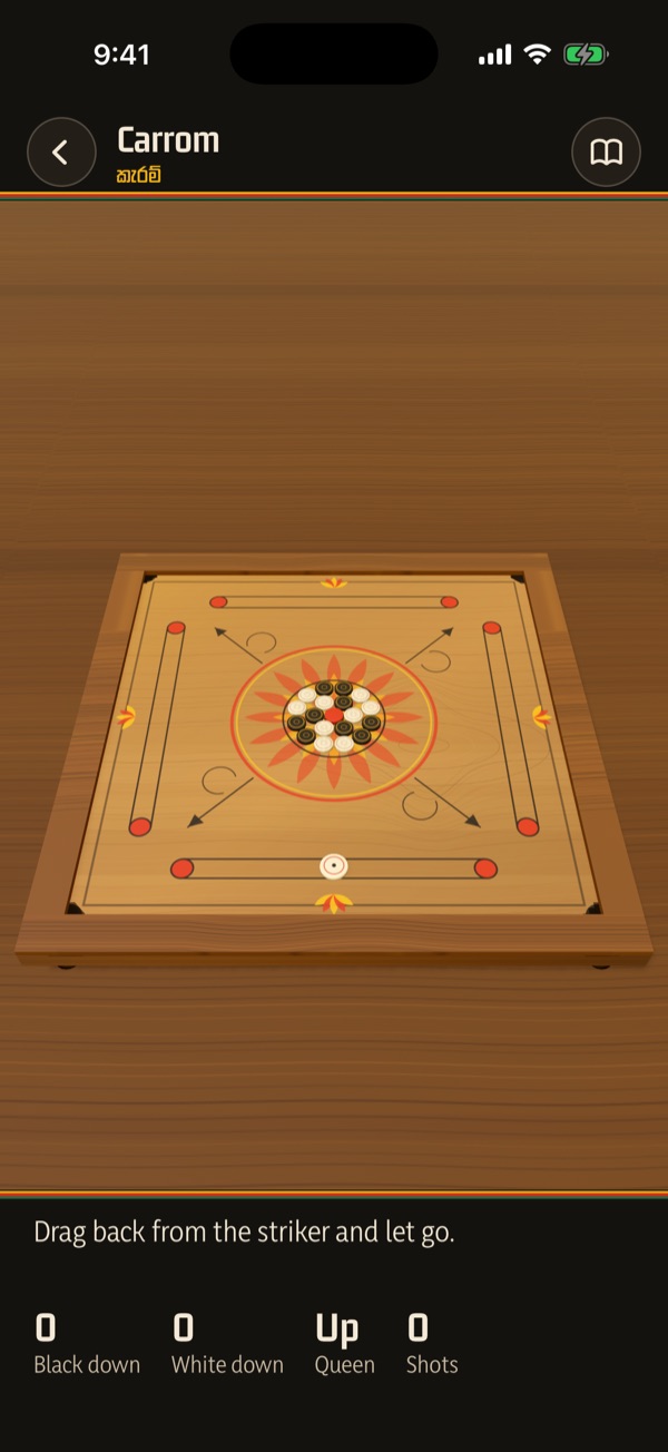 Carrom: the lacquered board with the men racked in the centre