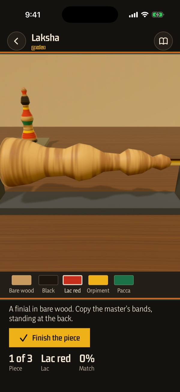 Laksha: a bare post turning on the lathe, with the master’s banded piece behind it